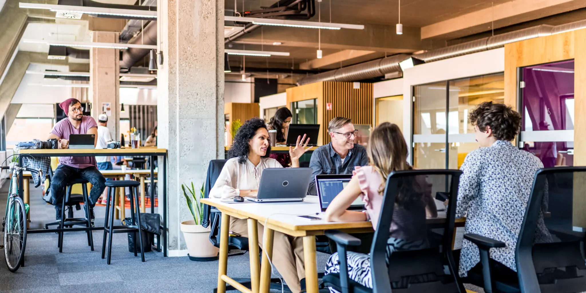 Open office space with people collaborating.